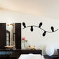 String light wall decal with black bulb outlines and curved wire