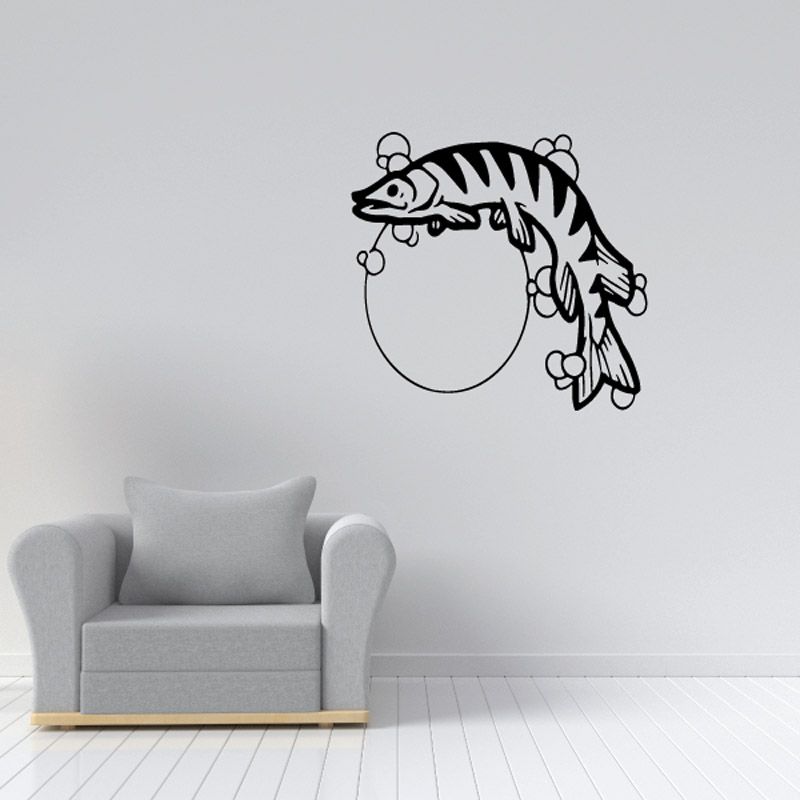 Wall decal of a striped fish with a moon-shaped circle outline
