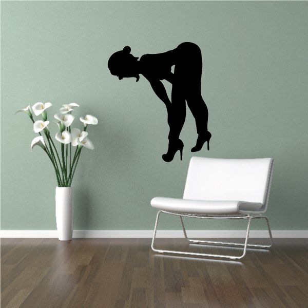 Bending-over elf silhouette wall decal with black shoe and long hair