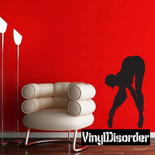 Silhouette decal of a woman fixing high heels