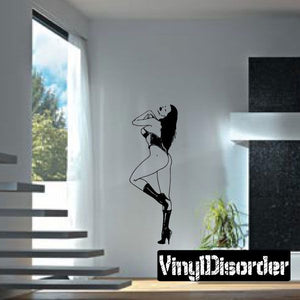 Black silhouette wall decal of woman in corset and high-heel boots