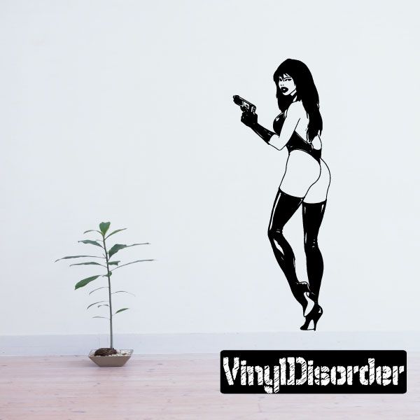 Gun-holding woman wall decal, black silhouette on white background