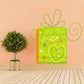 Green present die-cut decal with heart and doodle pattern, outlined in light green