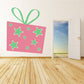 Pink present die cut decal with green bow and star cutouts, rectangular sheet