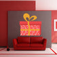 Red gift box die-cut decal with orange bow and ribbon details
