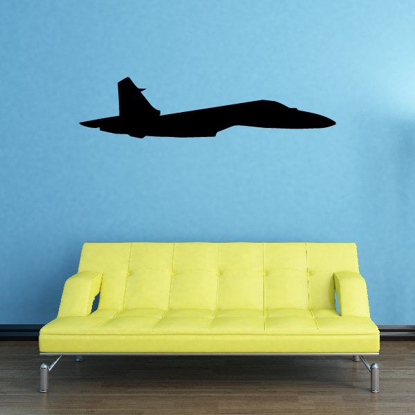 Black aircraft profile decal of a jet in side view on a wall