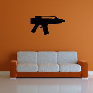 Black submachine gun wall decal with pistol grip and barrel silhouette