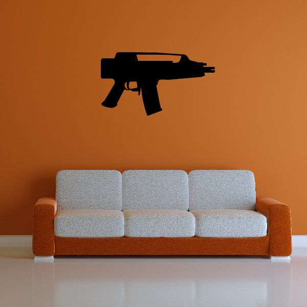 Black submachine gun wall decal with pistol grip and barrel silhouette