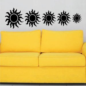 Set of black sun flare decals with five round sunburst icons