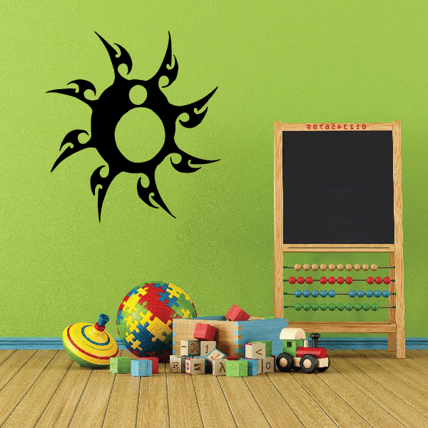 Tribal sun wall decal with bold black rays and green center circle