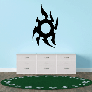 Vinyl wall decal with black flame shape and central light circle