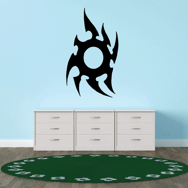 Vinyl wall decal with black flame shape and central light circle