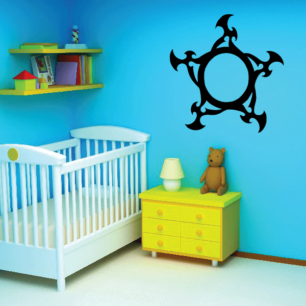 Black decorative sun wall decal with ornate swirling rays in circular medallion