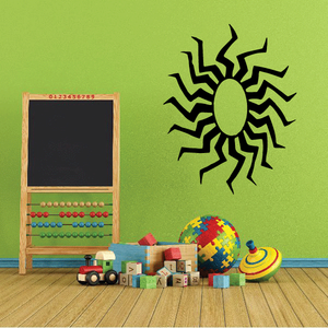 Sun wall decal with black rays and green center circle