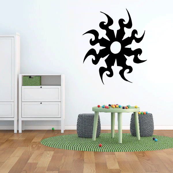 Black starburst vinyl wall decal with circular center and curling arms