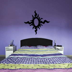 Black sun wall decal with flame-like rays, circular center ornament