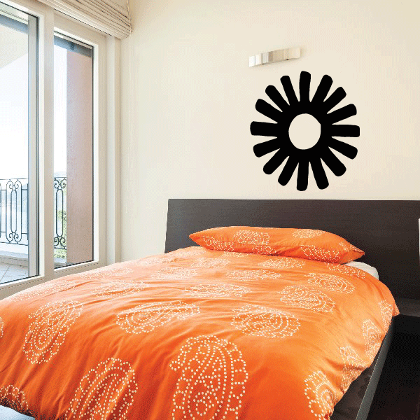 Black flower vinyl wall decal with circular center and radiating petals.