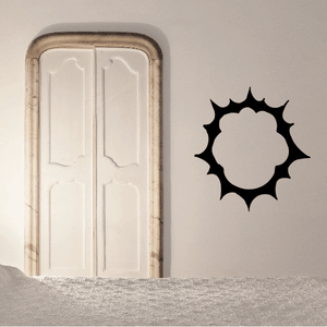 Vinyl sun wall decal with black spiked burst design