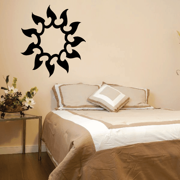 Black sun wall decal with spiky flame-like rays, vinyl sticker design