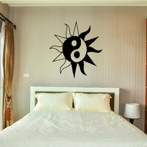 Yin yang sun wall decal, black vinyl with sunburst rays and yin-yang circles.
