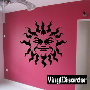 Sun zodiac wall decal featuring a black sun face graphic on a wall