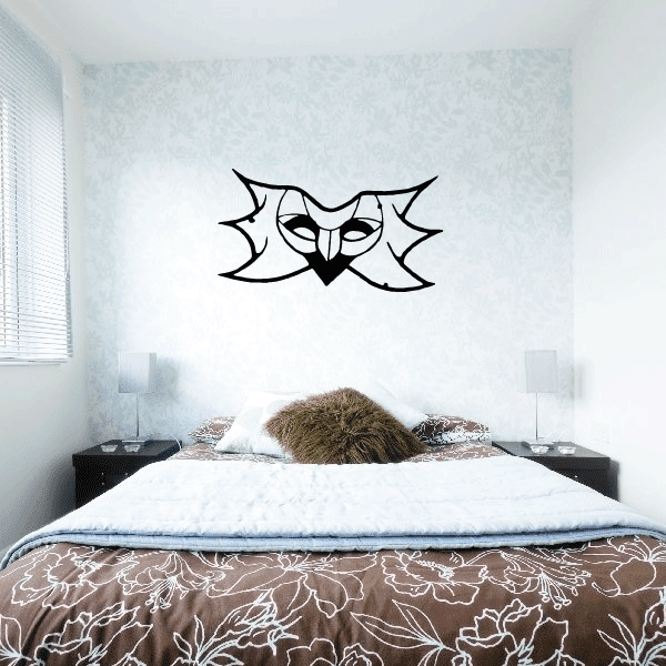 Black masquerade mask decal with sunburst-style rays and eye cutouts