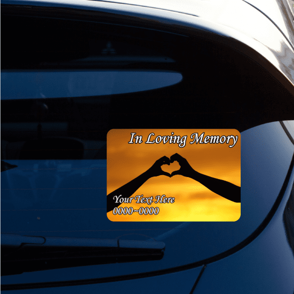 Memorial sticker: hand-heart silhouette with 'In Loving Memory' and 'Your Text Here'.