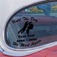 Car window decal with bold black memorial text and two silhouetted riders.