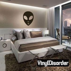 Surprised alien face decal with black head and facial features