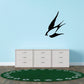 Diving swallow wall decal with black bird silhouette on green circular design
