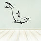 Dolphin swim-under decal with black outline, arcing body and tail fin