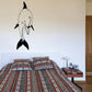 Black dolphin swimming over front wall decal