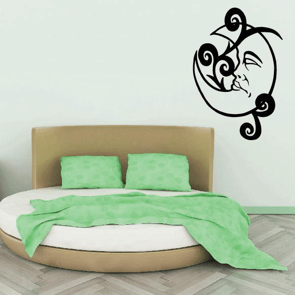 Black sleeping moon decal with curled swirly vines and sleeping face