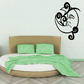 Black sleeping moon decal with curled swirly vines and sleeping face