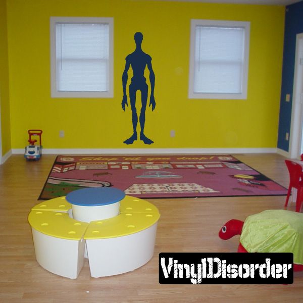 Tall alien silhouette wall decal with slim arms and legs, dark color