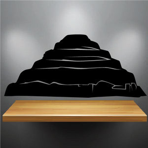 Black mountain island silhouette decal with tall layered peaks and shoreline outline