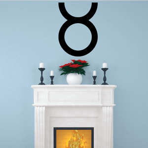 Taurus zodiac symbol decal, bold black bull-like sign on wall
