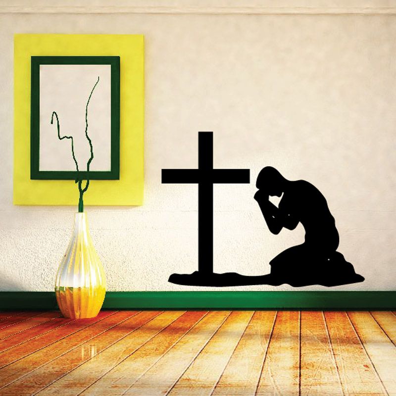Praying teen wall decal showing a kneeling figure with a cross