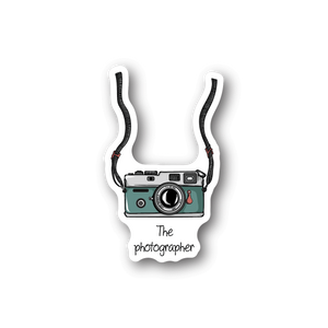 Vinyl sticker of teal camera with 'The photographer' text.