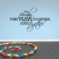 Family wall decal with script slogan 'that plays together stays together'
