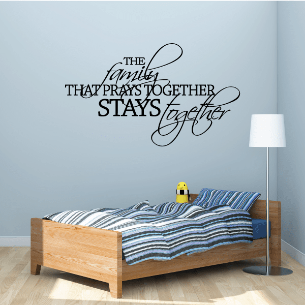 Wall decal text: 'The family that prays together stays together'