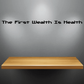 Health wall decal: 'The First Wealth Is Health' in black text
