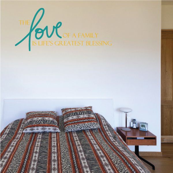 Inspirational wall decal with teal script and yellow text reading “Love of a Family”
