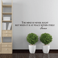 Quote wall decal with Seneca script: “The mind is never right…” on light wall