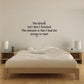 Wall decal with an inspirational quote in black script and serif text on a light wall.