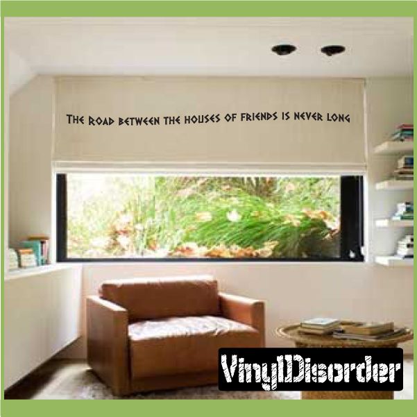 Wall decal with a quote reading "The road between the houses of friends is never long"