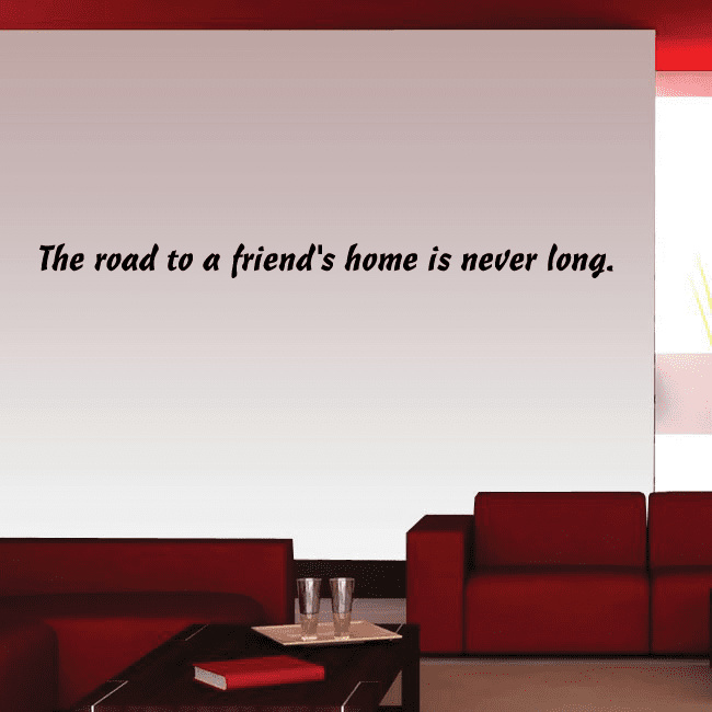 Wall decal with script text: “The road to a friend's home is never long.”