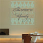 Christmas quote decal: 'The Spirit of Christmas is family' in teal and gold