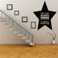 Black star quote wall decal with text, placed on wall near staircase