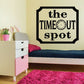Wall decal with black border reading the TIME OUT spot and a small clock